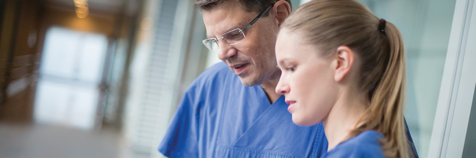 two doctors looking at ipad
